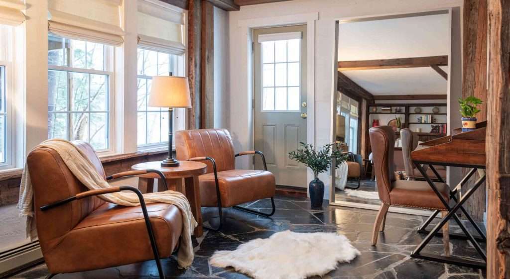 Two chairs and a desk in the comfortable sitting area in the honeymoon suite at Tucker Hill Lodge in Vermont