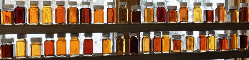 maple syrup bottles window sill